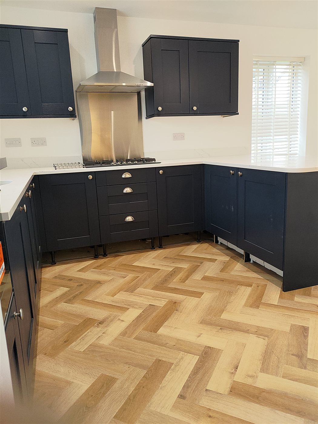Engineered oak herringbone flooring fitted in a Bolton hallway by Tred Luxury Flooring